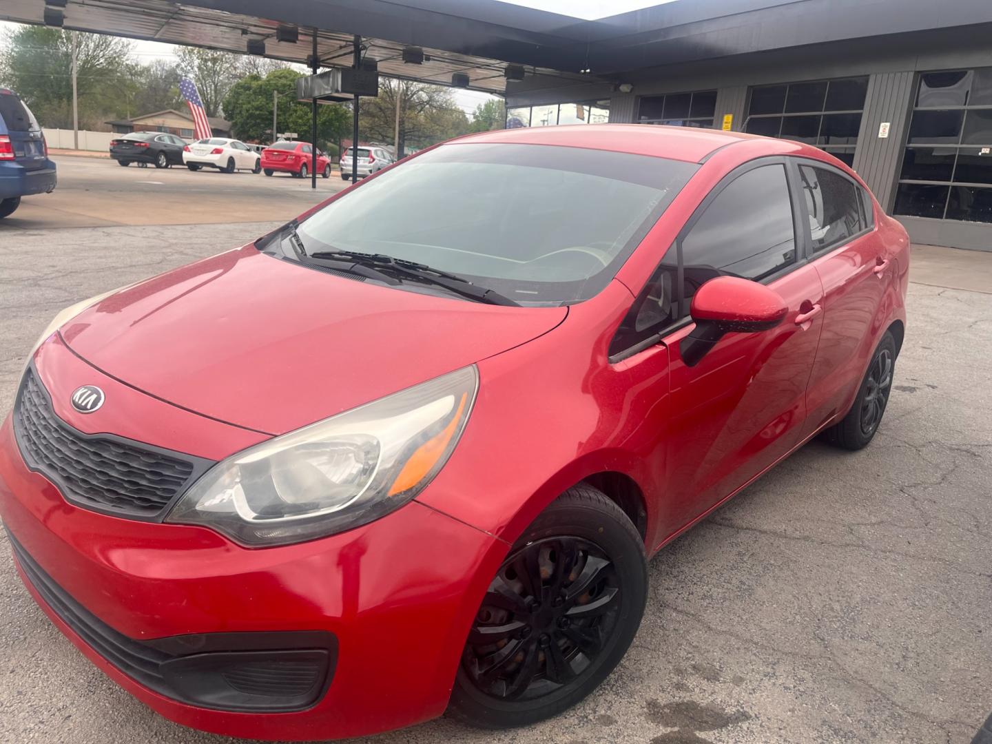 2015 RED KIA RIO LX LX (KNADM4A35F6) with an 1.6L L4 DOHC 16V engine, located at 8101 E. Skelly Dr., Tulsa, OK, 74129, (918) 592-3593, 36.121891, -95.888802 - Photo#0